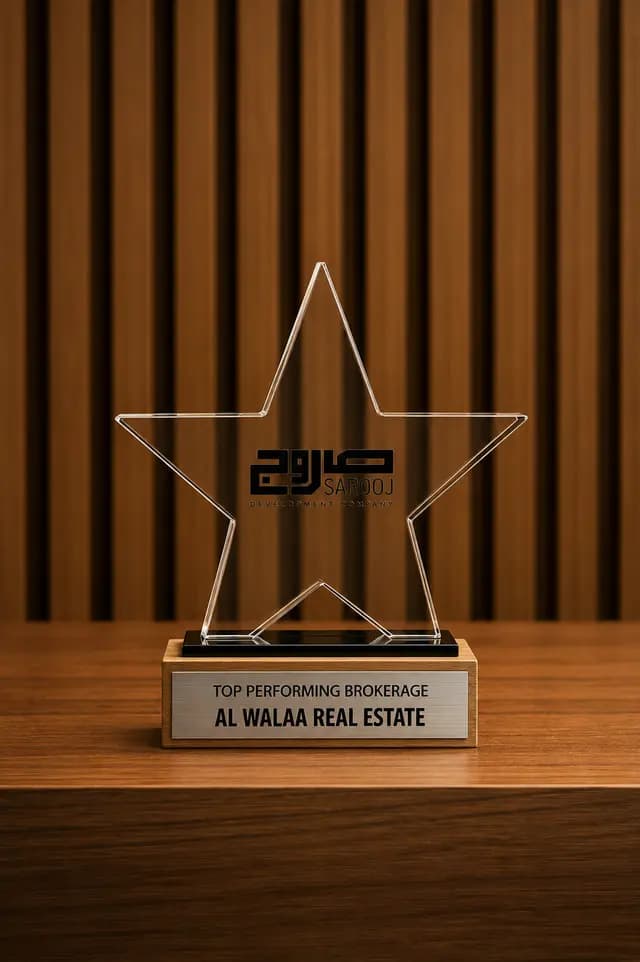 Clear star trophy on a timber base engraved Top Performing Brokerage, Al Walaa Real Estate